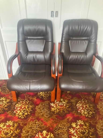 Photo of free 2 leather effect and wooden chairs (Drumcondra Dublin 9) #1