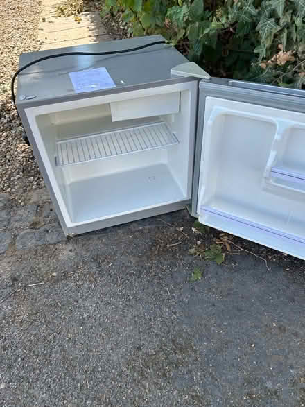 Photo of free Small white table top fridge in good working order (Horsell GU21) #2