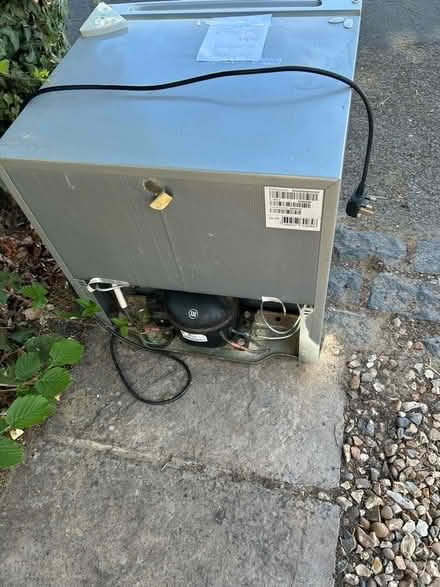 Photo of free Small white table top fridge in good working order (Horsell GU21) #1