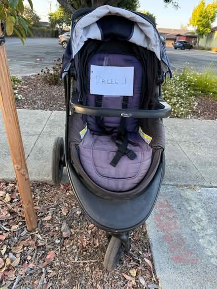 Photo of free Grace hooded stroller (1075 Valencia Avenue) #1