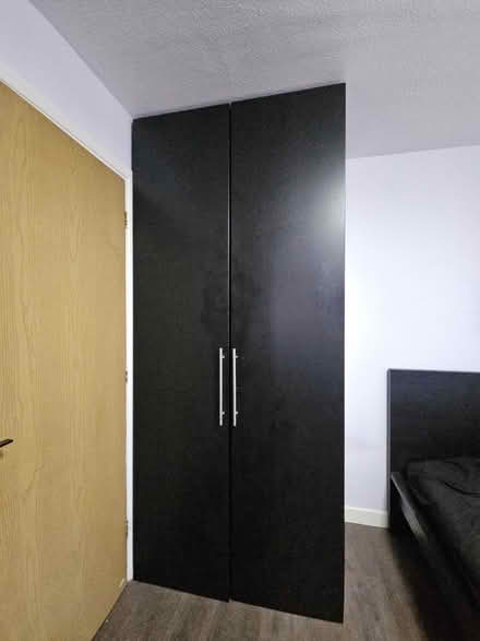 Photo of free Tall Black Wardrobe Storage Cabinet (upper holloway N19) #1