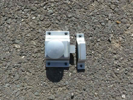Photo of free Silver tone metal cupboard/door catch (Kempsey WR5) #1