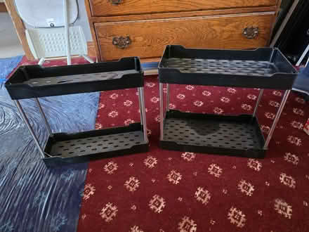 Photo of free 2 x black plastic shelves (Lydgate OL4) #1