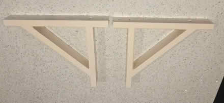 Photo of free 2 white painted wood shelf brackets (Frimley) #1
