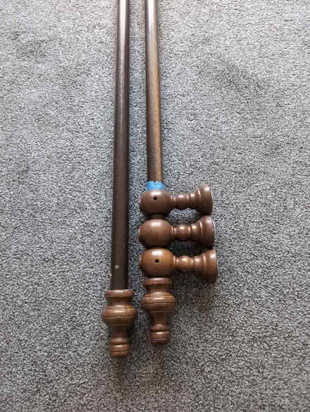 Photo of free Curtain poles 3m dark wood 35mm with rings (Heaton Norris SK4) #1