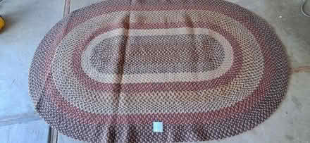 Photo of free 100 inch x 64 inch braided rug #1