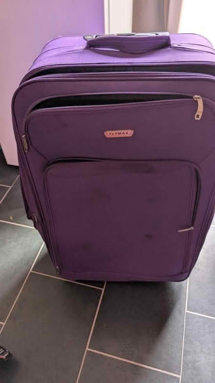 Photo of free Purple large suitcase (CF23 pentwyn) #1
