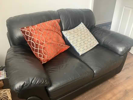 Photo of free 2 two black leather sofas (Thirsk) #1