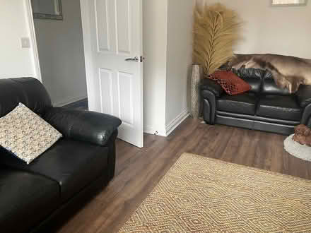 Photo of free 2 two black leather sofas (Thirsk) #2