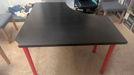 Photo of free Black corner table/desk w/ red legs (Culver/Mar Vista) #1