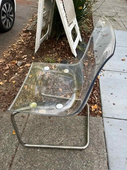 Photo of free IKEA Tobias acrylic chair w crack (715 C St, San Rafael) #2