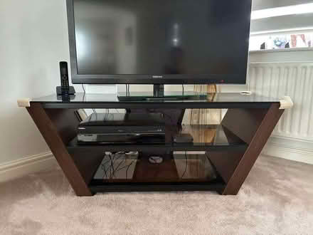 Photo of free Dark wood and glass TV unit (Wilson DE73) #1