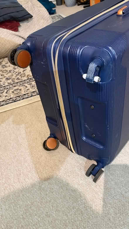 Photo of free Large Suitcase - broken wheel (Nevern Square SW5) #1