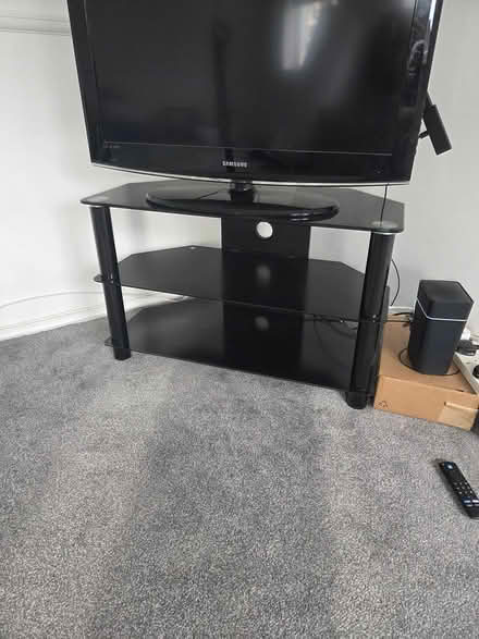 Photo of free Black glass TV stand (Staines TW18) #1