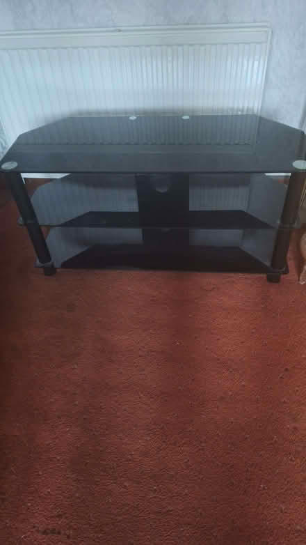 Photo of free Black glass television stand. (Forfar DD8) #1