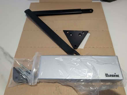 Photo of free 4 Overhead door closers with a black linkage arms (Wokingham RG40) #1