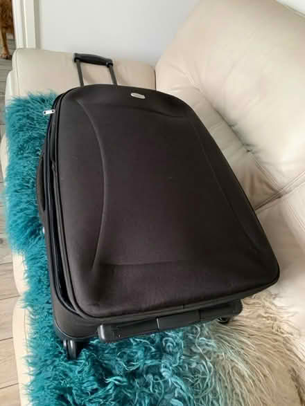 Photo of free Black medium sized suitcase (Leasowe CH45) #1
