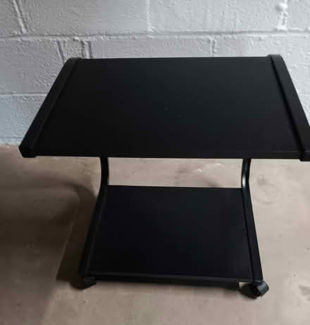Photo of free Small black table with wheels (Falls Church) #2
