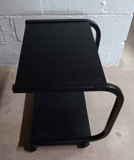 Photo of free Small black table with wheels (Falls Church) #1
