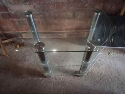Photo of free Tv table with glass shelves. (Wildwood ST17) #1