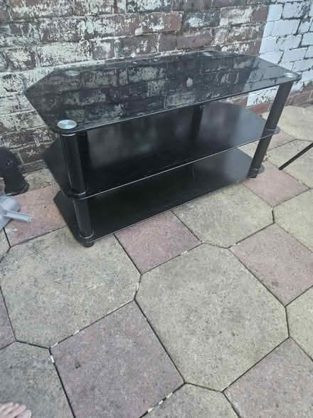 Photo of free Black glass TV stand (Lees OL4) #1