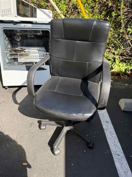 Photo of free Black vinyl office chair (1075 Valencia Avenue) #1