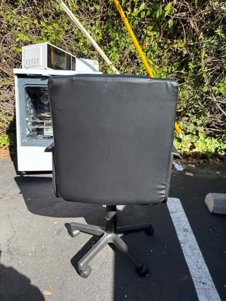 Photo of free Black vinyl office chair (1075 Valencia Avenue) #2