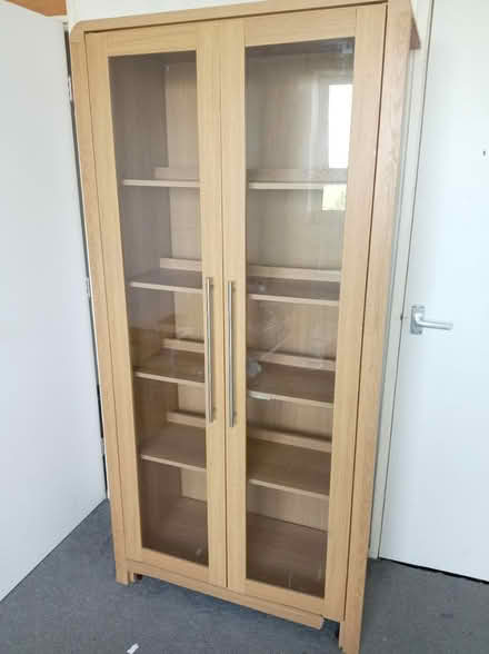 Photo of free Tall glass cabinet with light (Holmewood BD4) #1