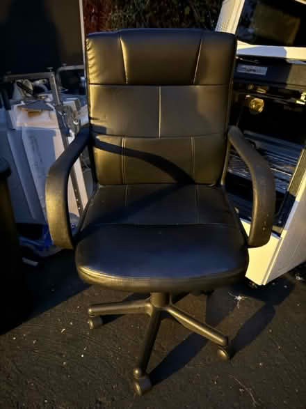 Photo of free Black vinyl office chair (1075 Valencia Avenue) #1