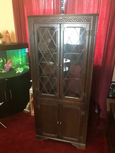 Photo of free Dark wood corner display unit (Romsey CB1) #1