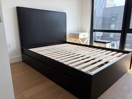 Photo of free Full size bed frame (Long Island City) #1