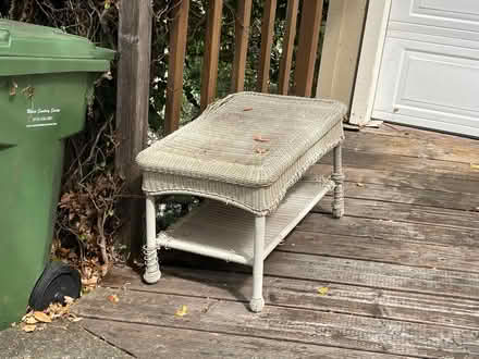 Photo of free Wicker patio table worn (133 Martens Blvd, San Rafael) #1