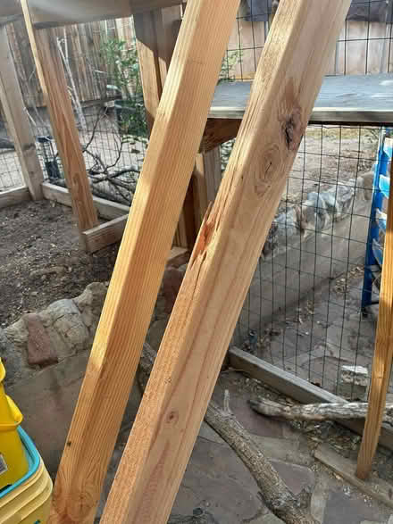 Photo of free Two 8' treated wood 2" x 4"s (UNM area) #1