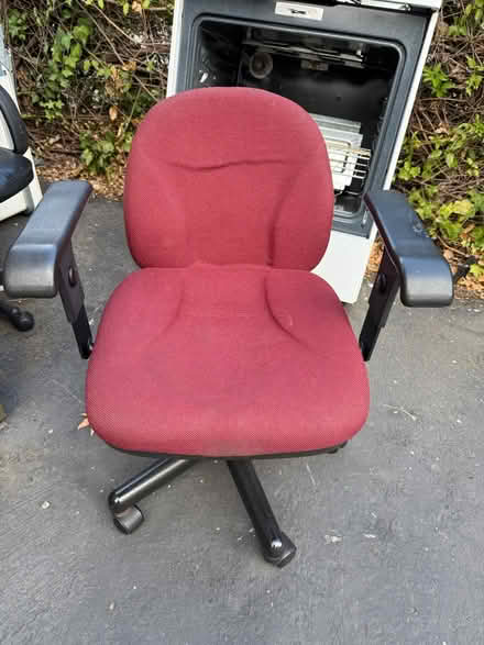 Photo of free Red upholstered fabric office chair (1075 Valencia Avenue) #1