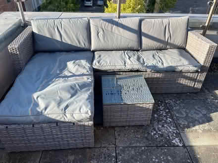 Photo of free Rattan style outdoor grey corner sofa with small glass table (Spencer Place RG21) #1