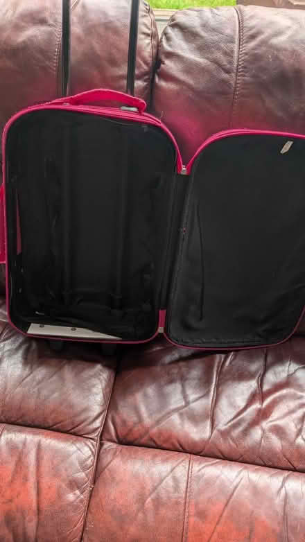 Photo of free Small pink suitcase on wheels (Dronfield S18) #2