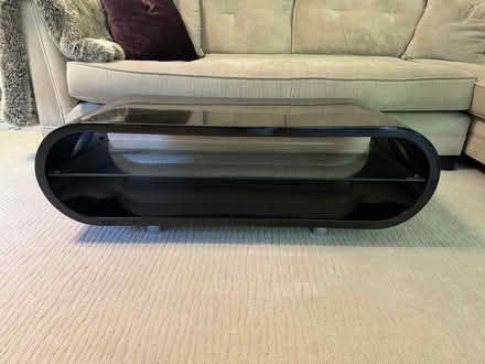 Photo of free Black lacquer tv stand with glass shelving (Holt Park LS16) #1