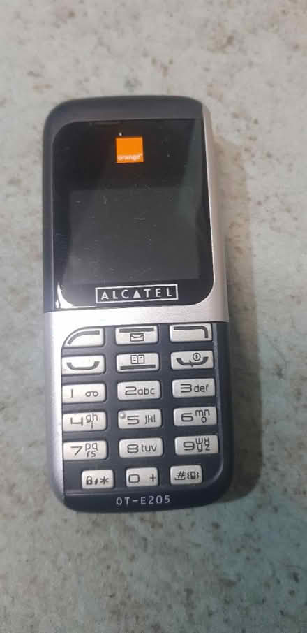 Photo of free Old Alcatel dumb phone, orange (Bates SW16) #1