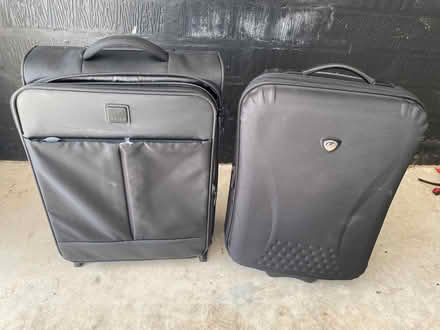 Photo of free 2 small black suitcases on wheels (Penyffordd CH4) #1