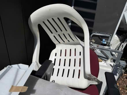 Photo of free White plastic patio chair (1075 Valencia Avenue) #1