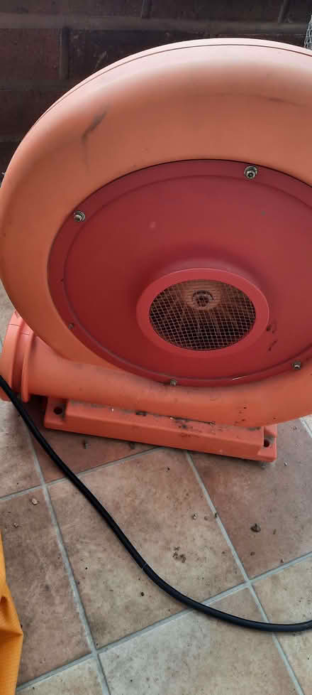Photo of free Bouncy castle (has holes) and blower (Knighton LD7) #1