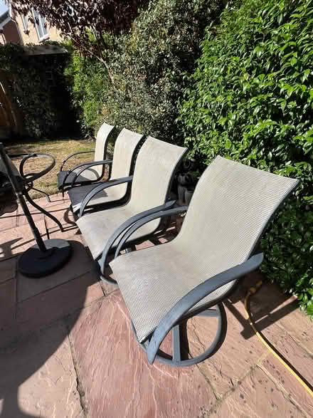 Photo of free 4 swivelling garden chairs (KT19 8FZ) #1
