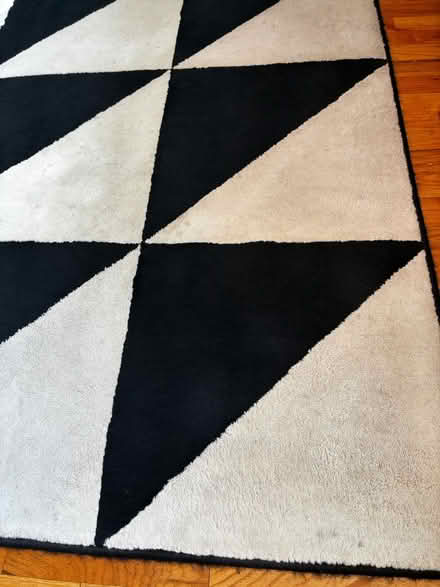 Photo of free 6’7” x 9’10” Black and Ivory Rug (Hillman City) #3