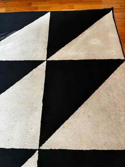 Photo of free 6’7” x 9’10” Black and Ivory Rug (Hillman City) #4