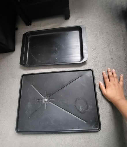 Photo of free 2 Black plastic utility trays (Bromley BR2) #1