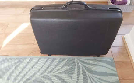 Photo of free Samsonite black suitcase (Bare LA4) #1