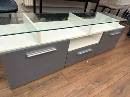 Photo of free Glass top tv stand (Knotty ash) #3