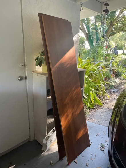 Photo of free 2 particle board wooden shelves (Vero beach fl) #2