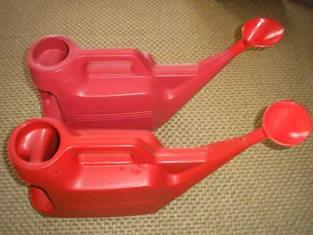Photo of free Two red plastic watering cans (Chapeltown LS7) #1