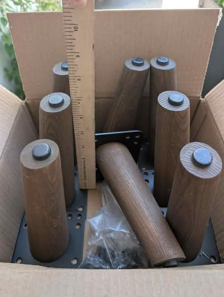Photo of free Dark wood furniture legs w/hardware (Teele Square) #1